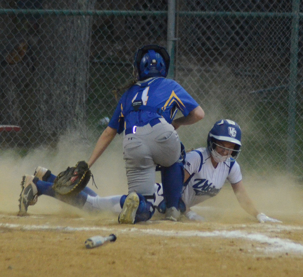 Valley Central’s Jackie Rometo scored as Washingtonville catcher Alexia Punch applies the tag during Wednesday’s OCIAA softball game at the Maybrook Little League complex in Maybrook.